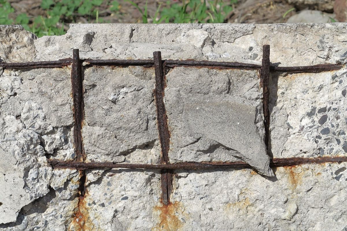 Spalling with corroded, exposed reinforcement — a defect class a model can be trained to flag for the engineer.