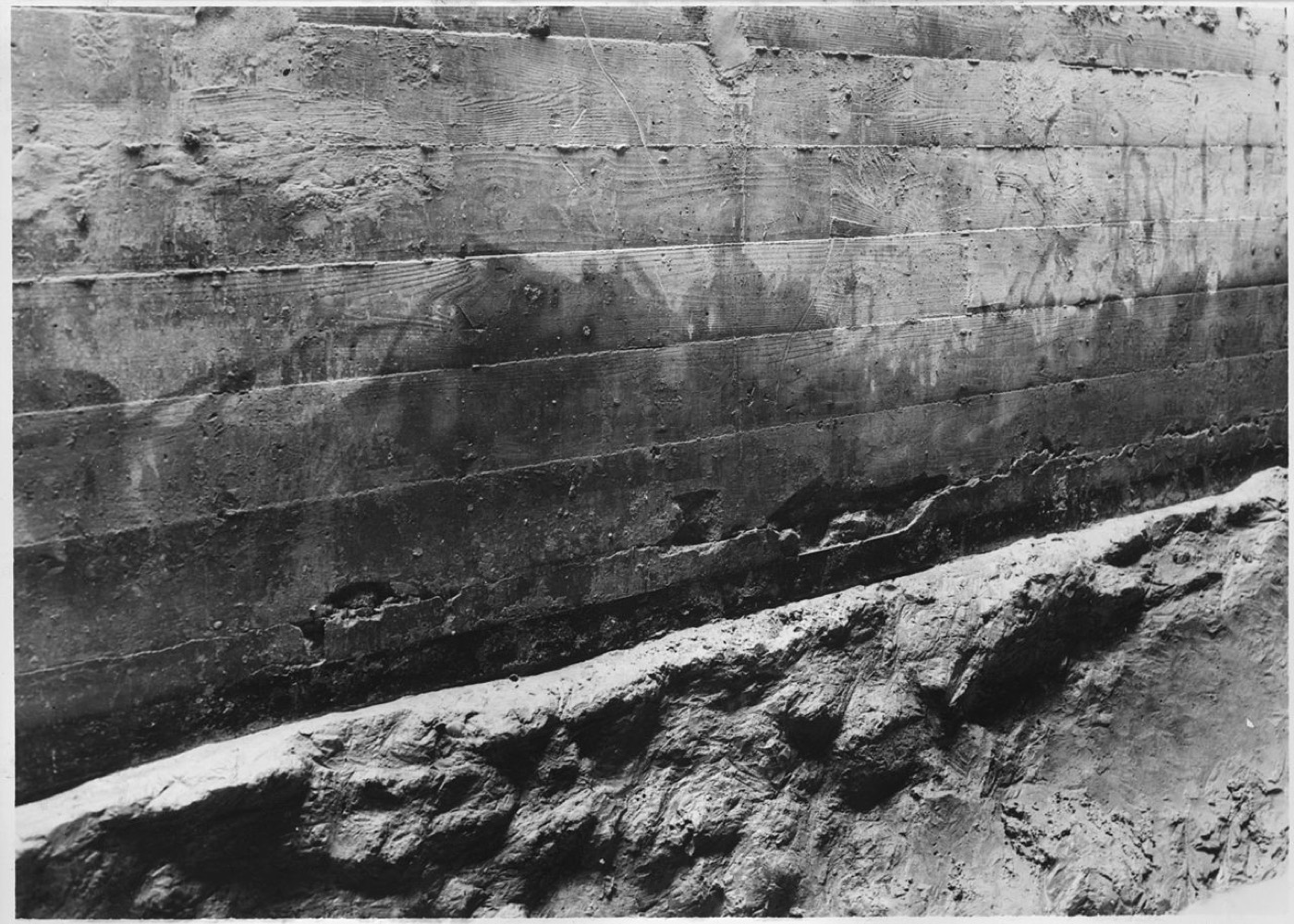 Close-up of a crack in the concrete of a highway bridge support pier